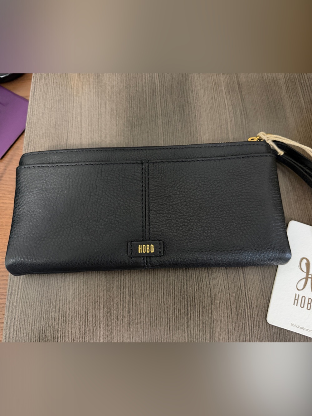 HOBO Black Pebbled Leather Zip Wallet with Tassel